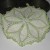 Crocheted potholder with white and green thread. Crocheted potholder with white and green thread.