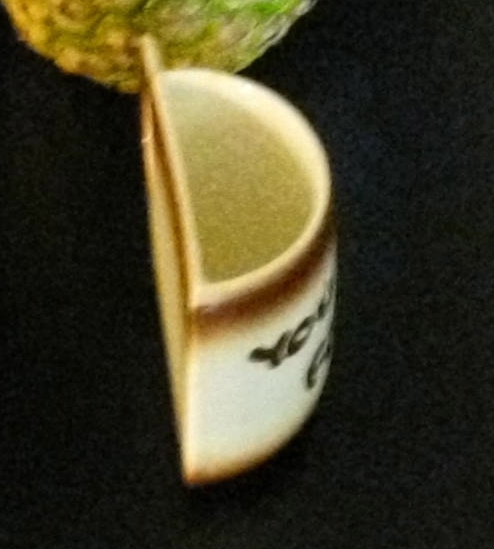 Aerial view of half coffee cup.