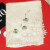 Tiny green flowers embroidered on handkerchief with lace tatting at corner. Tiny green flowers embroidered on handkerchief with lace tatting at corner.