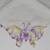Butterfly embroidered on the corner of a white vintage hankie. Butterfly embroidered on the corner of a white vintage hankie.