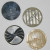 These large decorative sewing buttons are carved shell and plastic.
