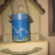 Painted tin can with handle and holes punched for the light to shine through. Painted tin can with handle and holes punched for the light to shine through.