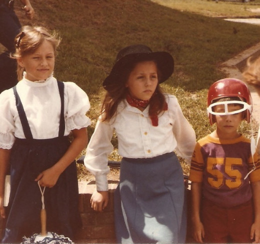 Yep - that's me in the middle as Annie Oakley for Halloween one year. (You can see my rifle in the grass behind me.)