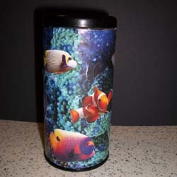 Tea tin covered with vivid images of saltwater fish and corals