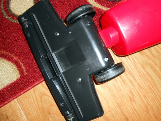 Bottom close up. No brush rollers for carpeting, though the suction is very strong and cleans low pile scatter rugs very well (AND quickly!)