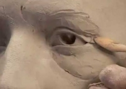 Ceramic sculptor Philippe Farautâs sculpts an old man's eyes