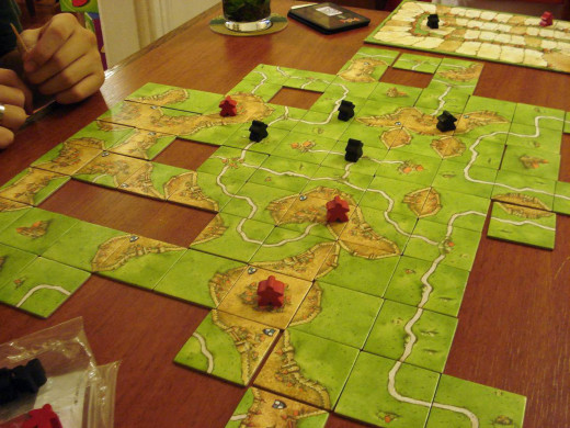 Partway through the Carcassone game.  Image by Stella Dauer, CC BY-SA 2.0http://www.flickr.com/photos/49973009@N00/2244158379/