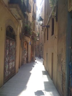 Do you see an empty street, maybe a little scary, or one awash with sunlight?