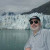 This photo of my husband, taken on the balcony of our room on the ship, will give you some idea of the size of the glaciers.  The ship was over 1 mile away from the glacier you see in the background.
