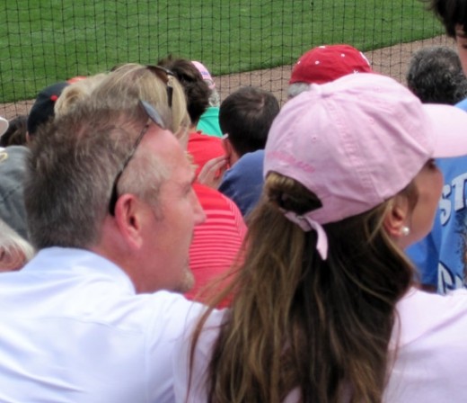 Rams head coach, Steve Spagnuola, was seen at the ballpark giving an autograph to a young fan.