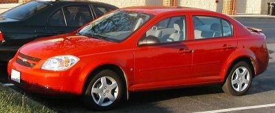 Chevrolet Cobalt:  It's not a hybrid, but it's greener than the hyrbid version of the Toyota Highlander.