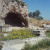 In the foreground, a temple to Hades. In the background, the Grotto where some sort of passion play took place celebrating Persephone's return. See the hole in the side of the cave? It's invisible from every angle but this one. It would have been eas