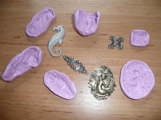 Step 3: Once set, peel away from the objects to reveal your new custom molds! Step 3: Once set, peel away from the objects to reveal your new custom molds!