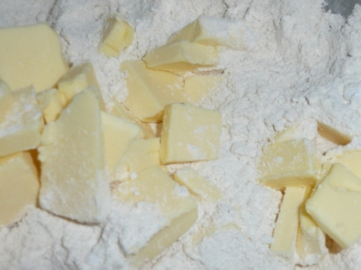 3. Add the cubed butter to the flour mix and rub in with your fingertips