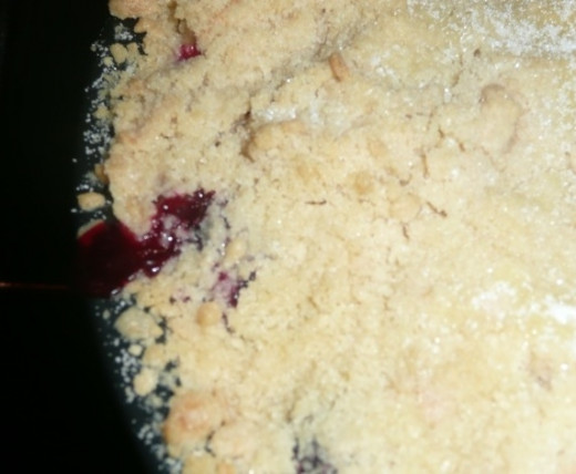 10. Bake in the oven for 35-40 minutes, or longer if needed. When you see the fruit bubbling through the surface of the golden crumble, like this, it's ready!