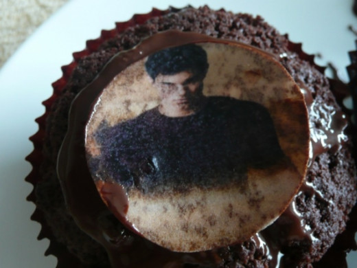 4. Top the cupcake with some melted chocolate and a sexy Jacob cupcake topper!