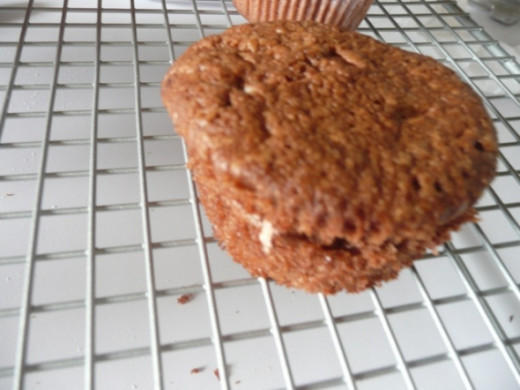 3. Wedge the cupcake back together and freeze. Bring back out and top with melted chocolate topping, before freezing again