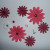 Pink and burgundy Gerbera daisy fabric flowers, plus one white daisy, black brads and pink rhinestones Pink and burgundy Gerbera daisy fabric flowers, plus one white daisy, black brads and pink rhinestones
