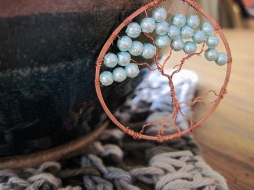 Tree of life in copper and soft baby blue painted glass beads