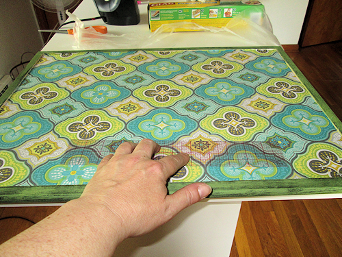 I laid the fabric at the bottom edge first and worked my way up. I used my trusty ruler to push out any bubbles working from the bottom to the top.