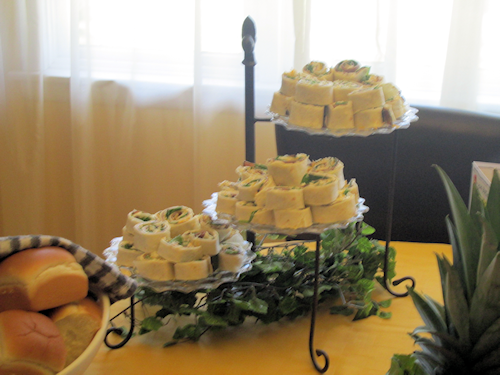 Pinwheels on a spring buffet. I used clear Fostoria plates here. Note the greenery at the base of the 3 tiered stand.