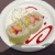 Frushi - Fresh Strawberries, Pineapple and Cantaloupe, rolled with Coconut Rice, atop a Raspberry Sauce sprinkled with Toasted Coconut and Whipped Cream