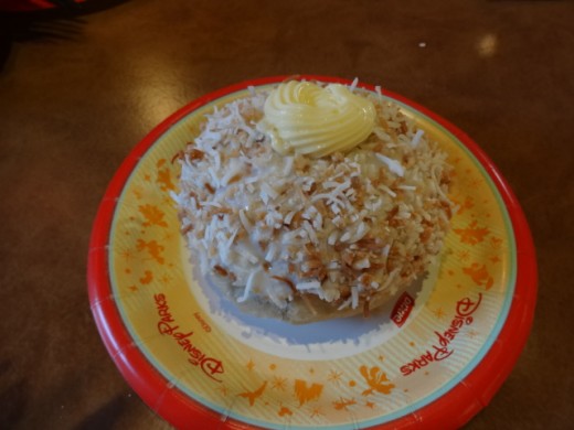 Dessert from the Country of Norway -  School Bread: Sweet cardamom bun filled with vanilla creme custard and topped with glazed and toasted coconut
