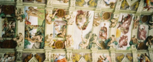 Along the middle of the ceiling - the famous "God and Adam touching fingers" section is in the center. (tilt your head to the left to see it better.)