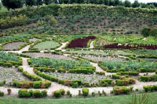 The Garden of Abundance, a vegetable garden laid out in the shape of a leaf.  On the bank behind is the Crescent of Fragrances.