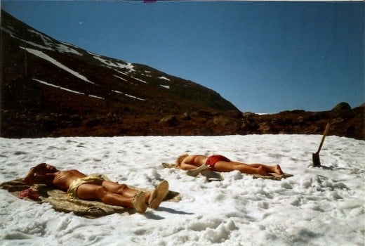 Only in Norway.  Two of my good friends sunbathing.  On top of a sheet of snow.  In June.  What a wonderful place!