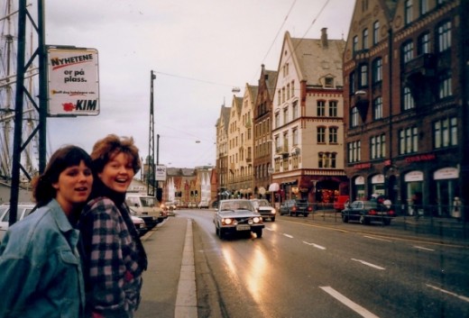On the streets of Bergen, Norway.  The famous Bryggen buildings are on the right side (A World Cultural Heritage Site).