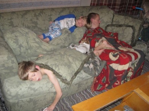 Everyone asleep...the dog in the middle of them all