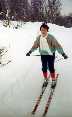 Successfully skiing down a gentle slope on a cross country trail