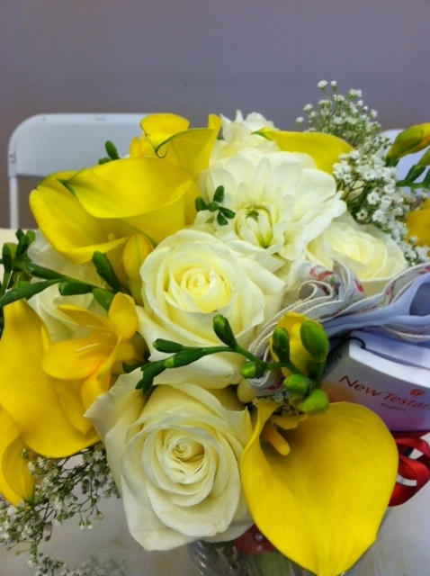 Bridal bouquet with roses, dahlia, gypsophila, freesia and a little Bible tucked in. 