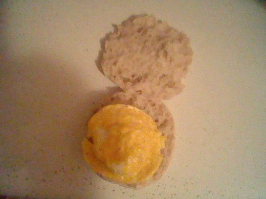 Place the egg on the center of the muffin.