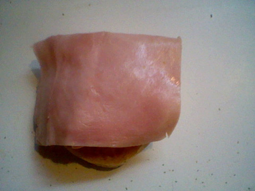 Place the ham on top of the egg.