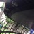 Under the trampoline mat - a hook attaches to each metal strip. Then, safety rings are attached after that. Great design. Under the trampoline mat - a hook attaches to each metal strip. Then, safety rings are attached after that. Great design.