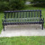 A bench under a tree or in the shade.