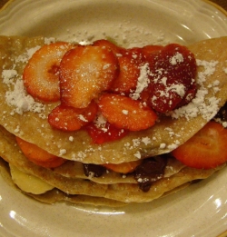This double decker crepe contains strawberries, bananas, chocolate chips, and powered sugar!