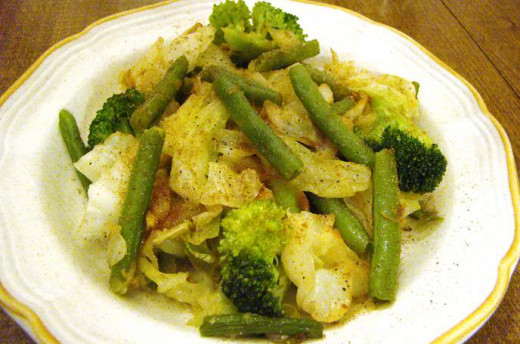 Steamed Broccoli, cabbage and green beans, with curry spices and extra virgin olive oil