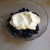 Put two tablespoons of yogurt on the blueberries Put two tablespoons of yogurt on the blueberries