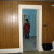 View of paneling in kitchen on one wall. That is Lana surveying the living room. View of paneling in kitchen on one wall. That is Lana surveying the living room.