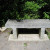 Donated bench beside boulder inscribed with, "Make this world a little better and more beautiful because you live in it."