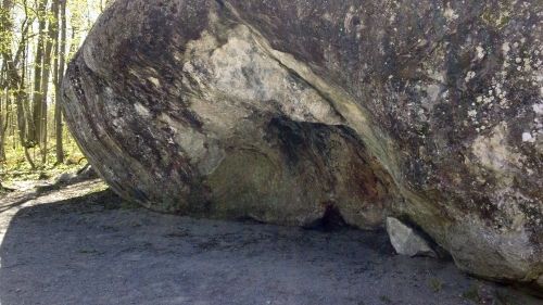 Mini cave visible from front of boulder.