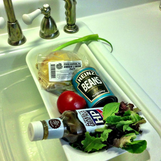 This is a drainer for dishes, extra workspace and great for cleaning vegetables