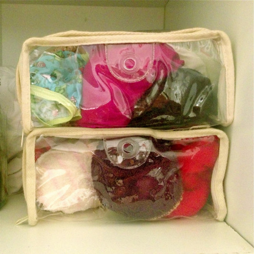Showing off my underwear! These are plastic containers that sheet sets came in. They are idea for storing small clothing items if you have no dresser