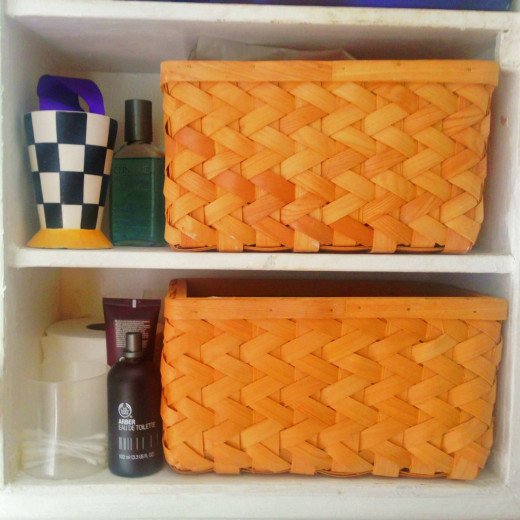 We each have a basket in the bathroom cupboard to hold toiletries that are used regularly