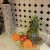 A glass bowl holds fruit. It's decorative and seems to 'disappear' giving the illusion of space
