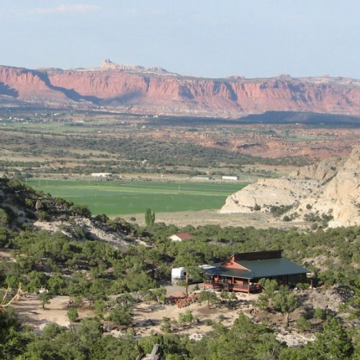 House on Boulder Mountain with Capital Reef in the background