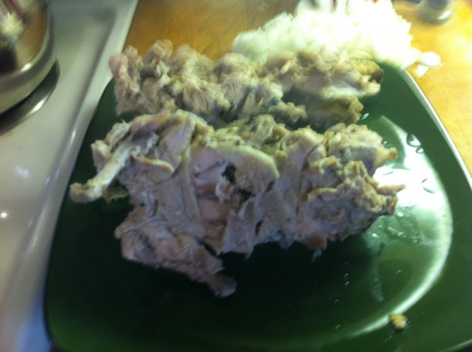 Remove carcasses from the broth, set aside and let cool.